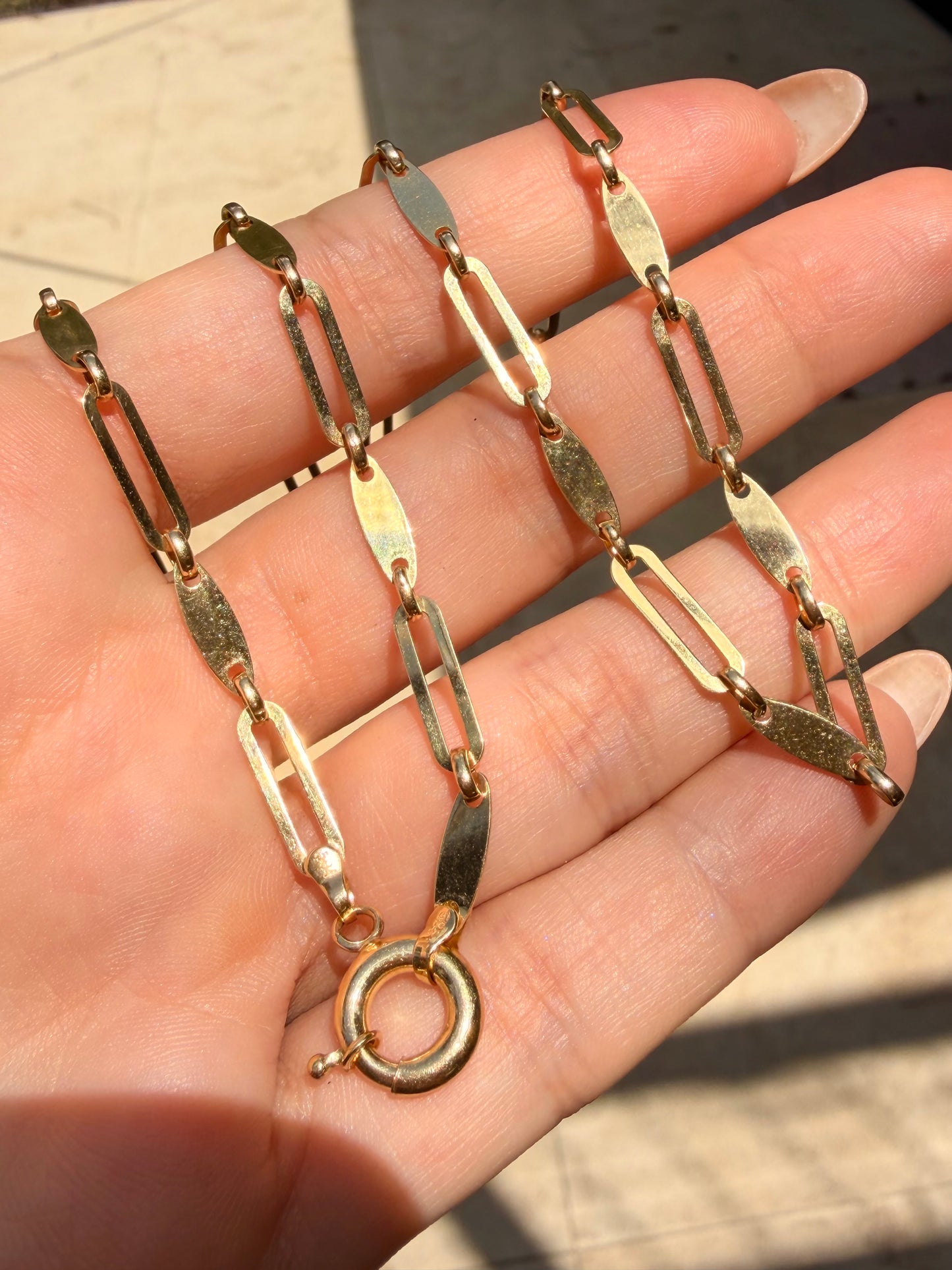 Yellow 14K gold disc and oval link chain with bolt clasp, 22 inch