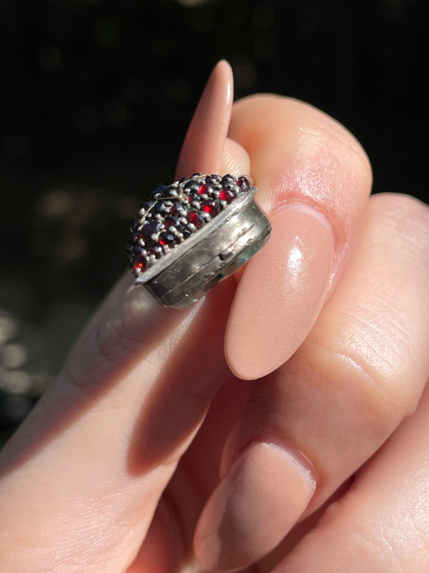 Antique sterling garnet heart celestial glass back locket charm
