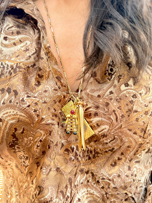 Vintage yellow 18K articulated jester pendant with over 3.1 ctw natural gemstones