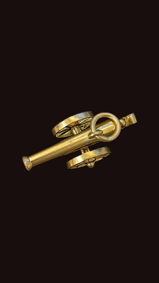 Vintage yellow 14K articulated cannon charm