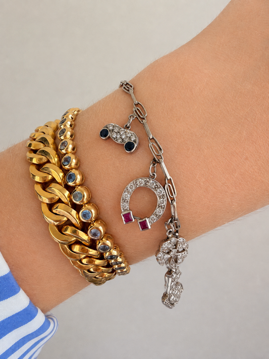 Antique platinum Art Deco charm bracelet with 1 ctw diamonds, sapphires and rubies, 7 inch