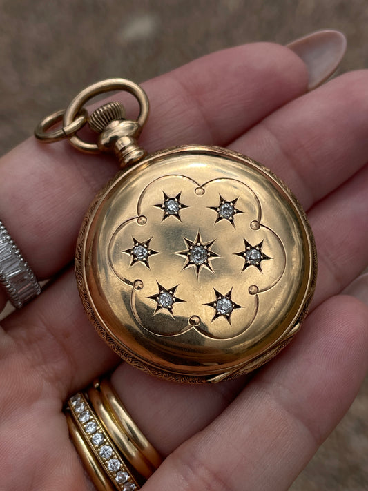 Antique yellow 14K and star set old cut diamond pocket watch with pink enamel detail