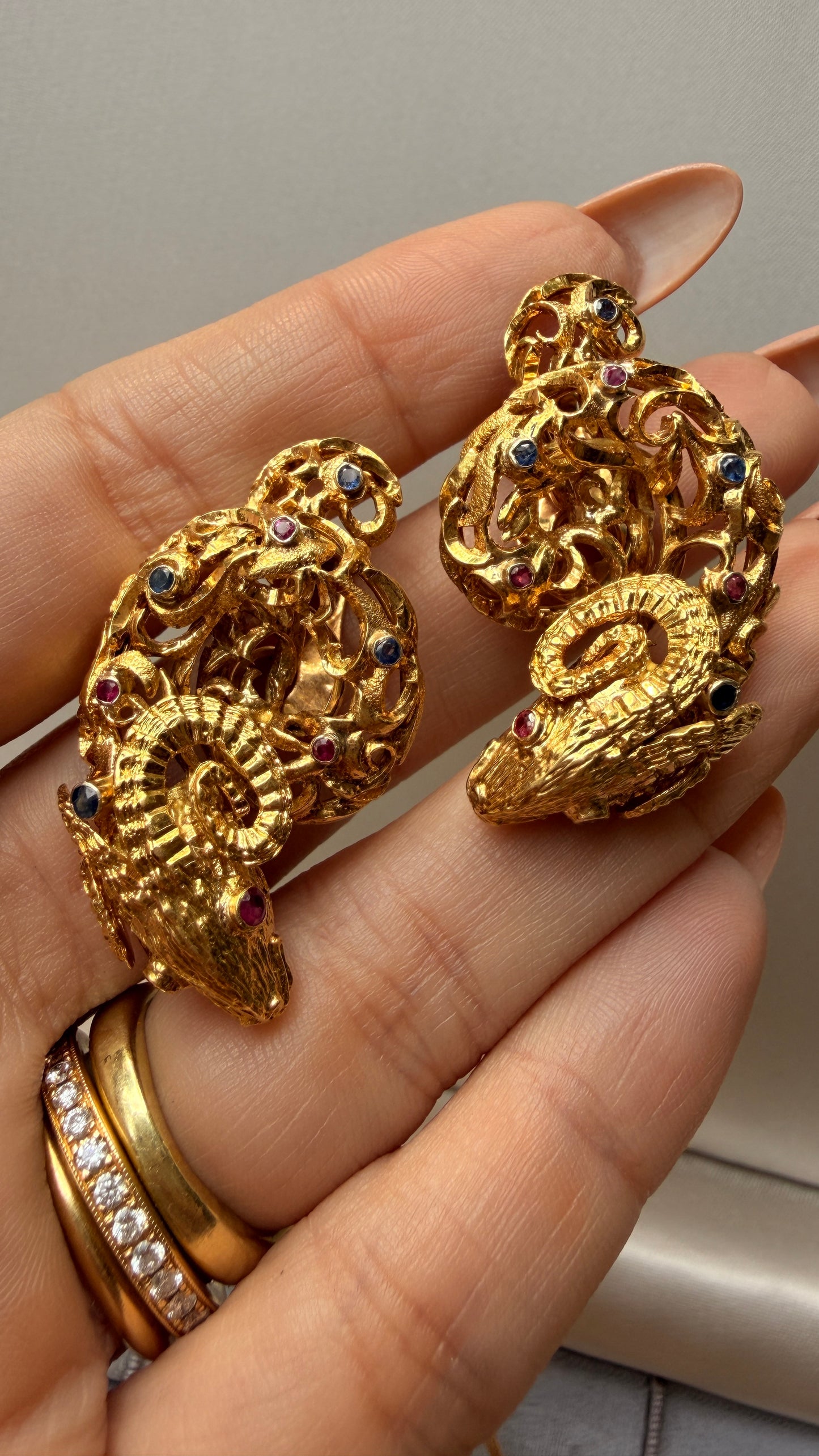 Vintage circa 1960s yellow 18K approx .6ctw sapphire and ruby ram clip statement earrings
