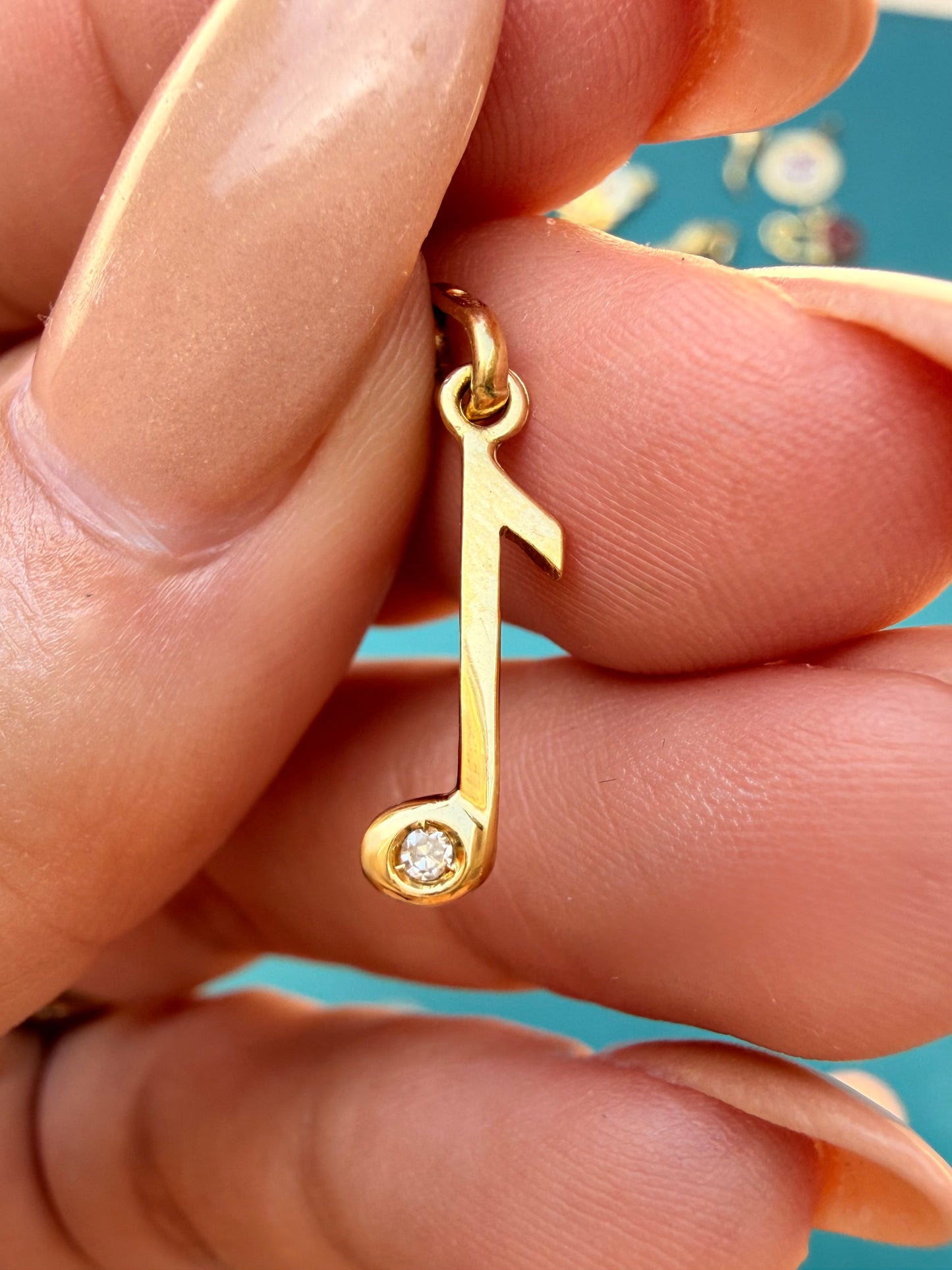 Vintage yellow 18K gold and diamond music note charm