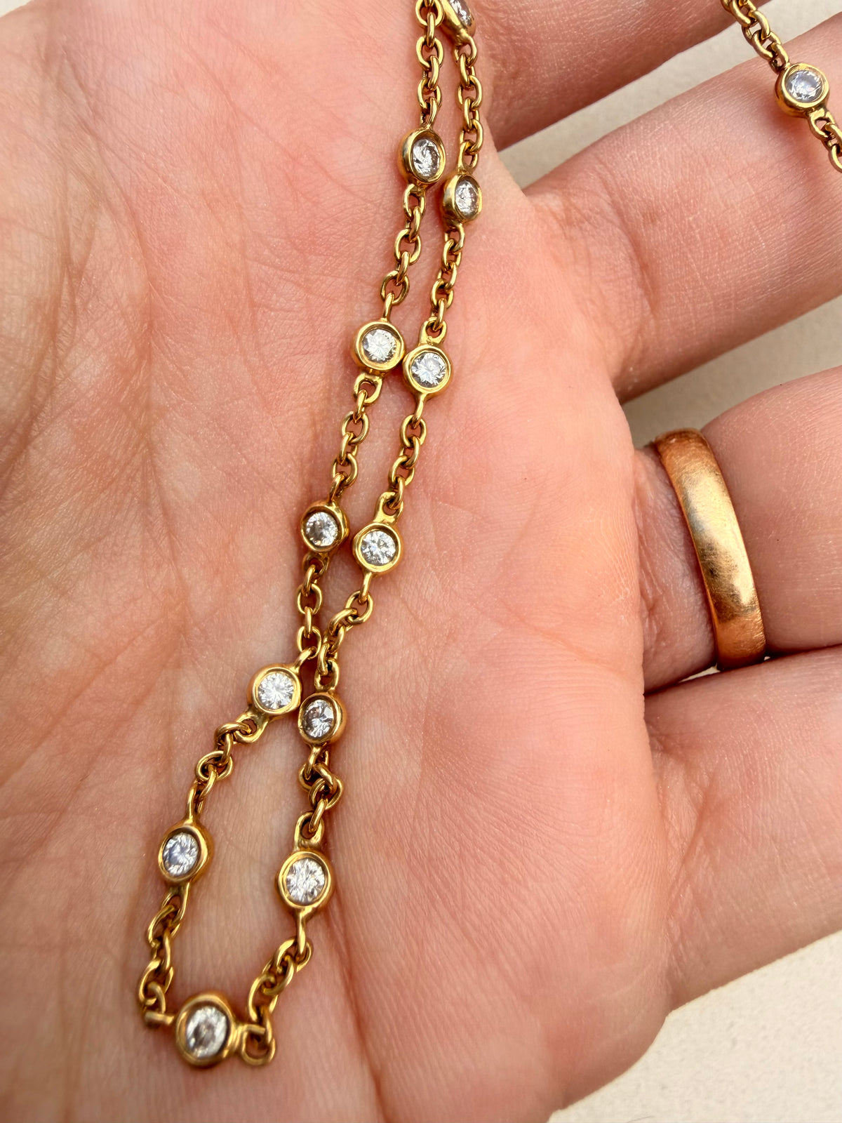 Vintage yellow 14K approx 1.4 ctw diamond bezel station chain with cuff clasp, 17.5 inch