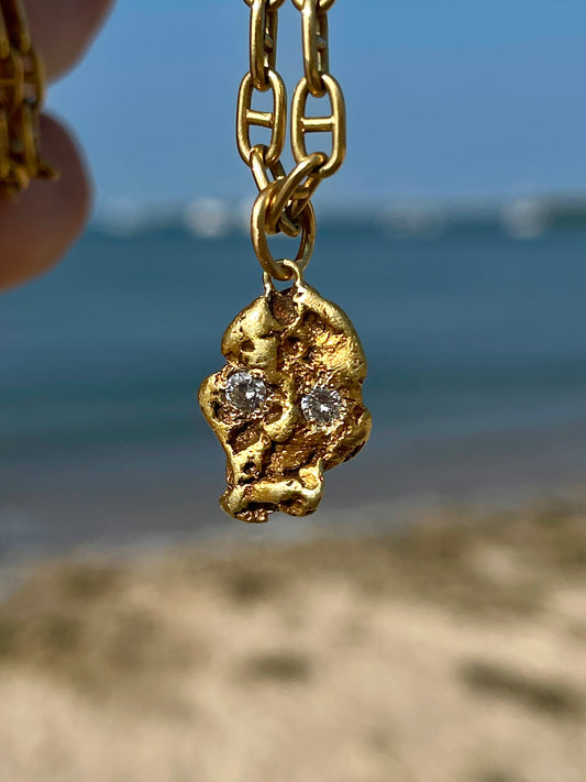 Vintage yellow 18K to 24K gold nugget skull with .12 ctw diamonds charm