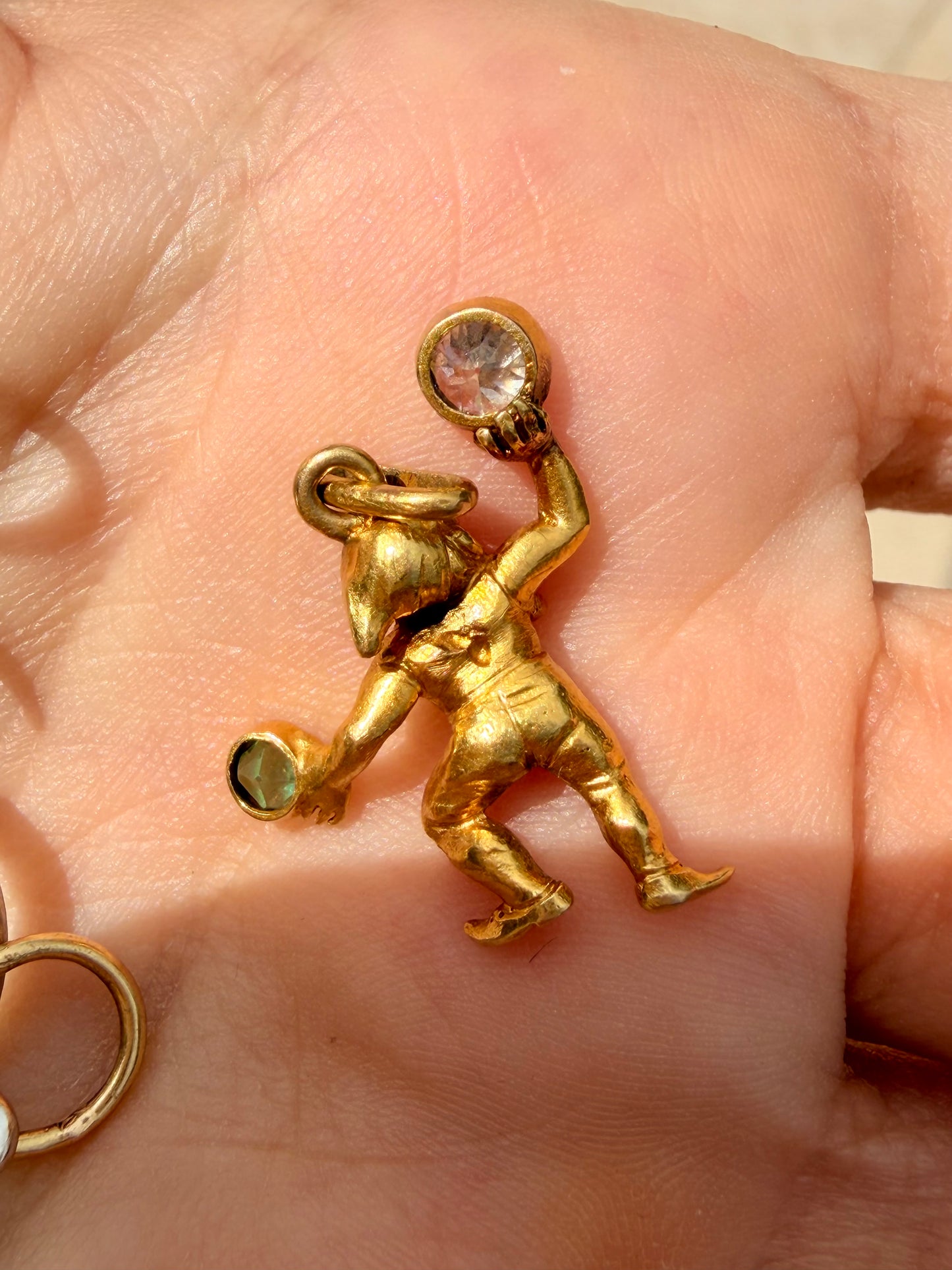 Antique yellow 19K gnome pendant with approx .27 ctw diamond and .15 ctw emerald