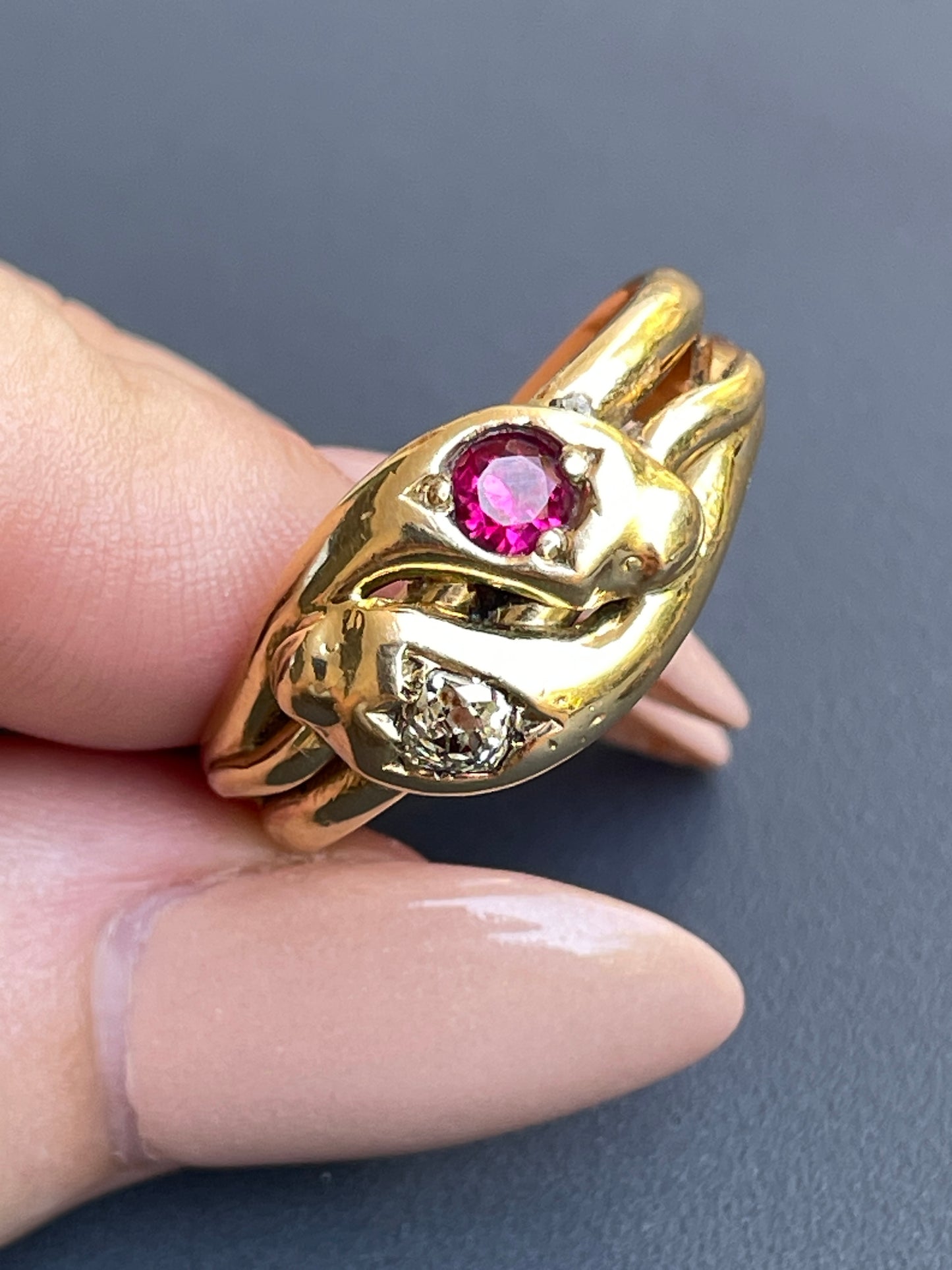 Antique Victorian yellow 18K pair of snakes ring with .25 ctw old mine cut diamond and .35 ctw ruby, size 11