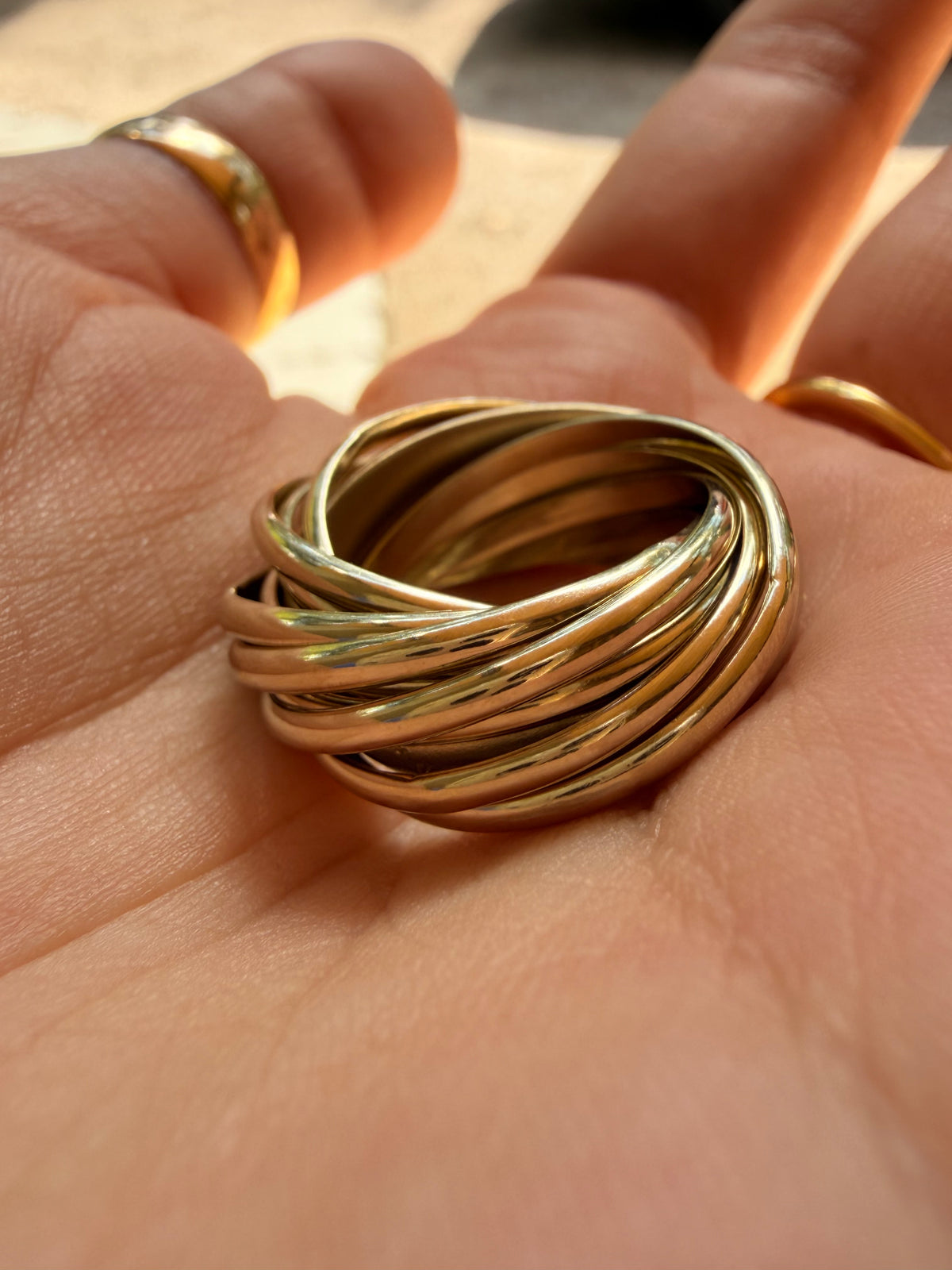 Vintage yellow 18K Pomellato designer eleven band rolling ring, size 6.25-6.5
