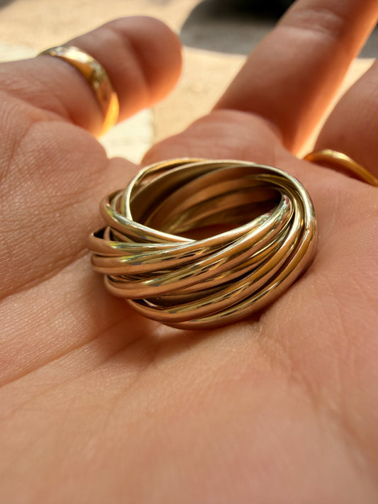 Vintage yellow 18K Pomellato designer eleven band rolling ring, size 6.25-6.5