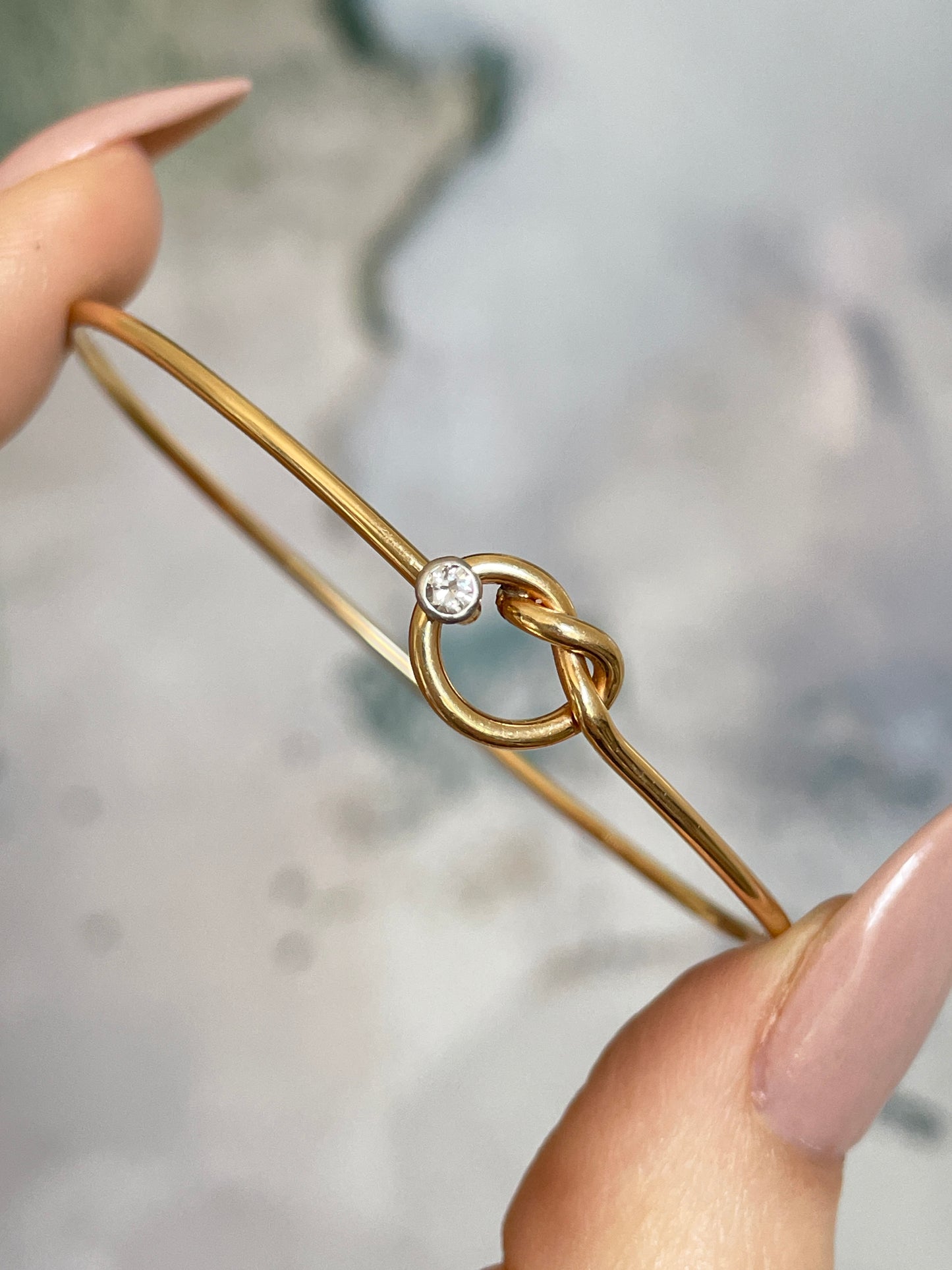 Vintage yellow 14K gold approx .03ctw diamond love knot bangle