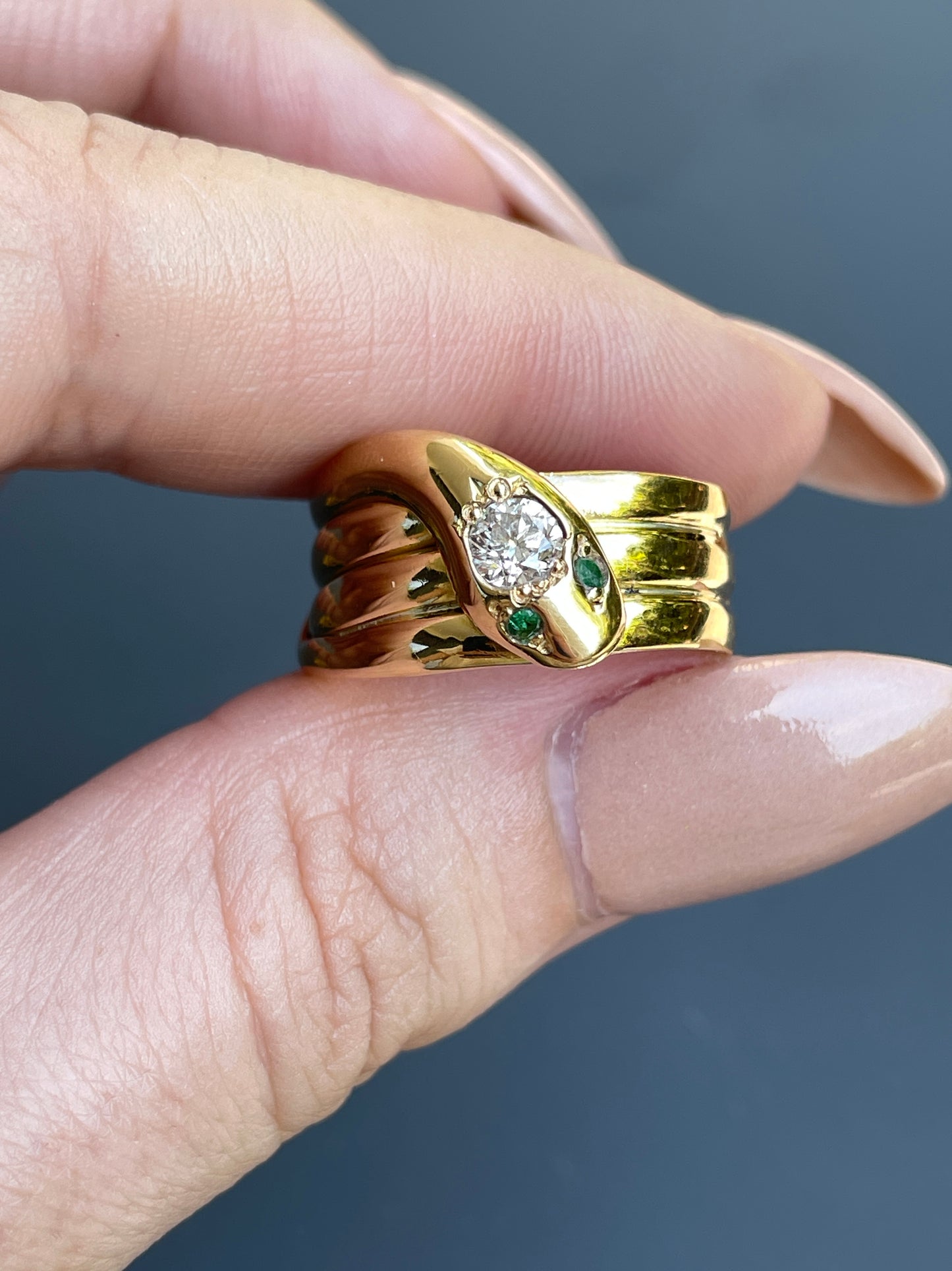 Vintage yellow 18K snake ring with approx .45 ctw diamond and emerald eyes, size 7.5