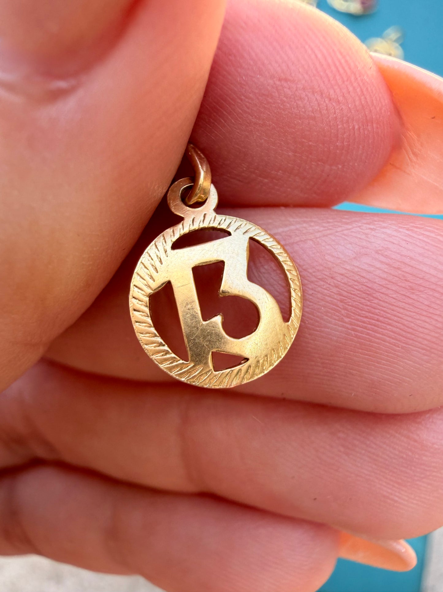 Vintage yellow 18K gold number 13 charm