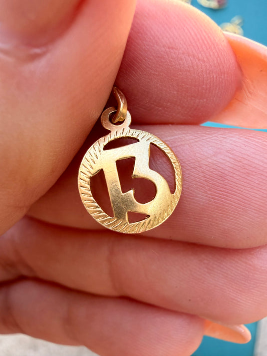 Vintage yellow 18K gold number 13 charm