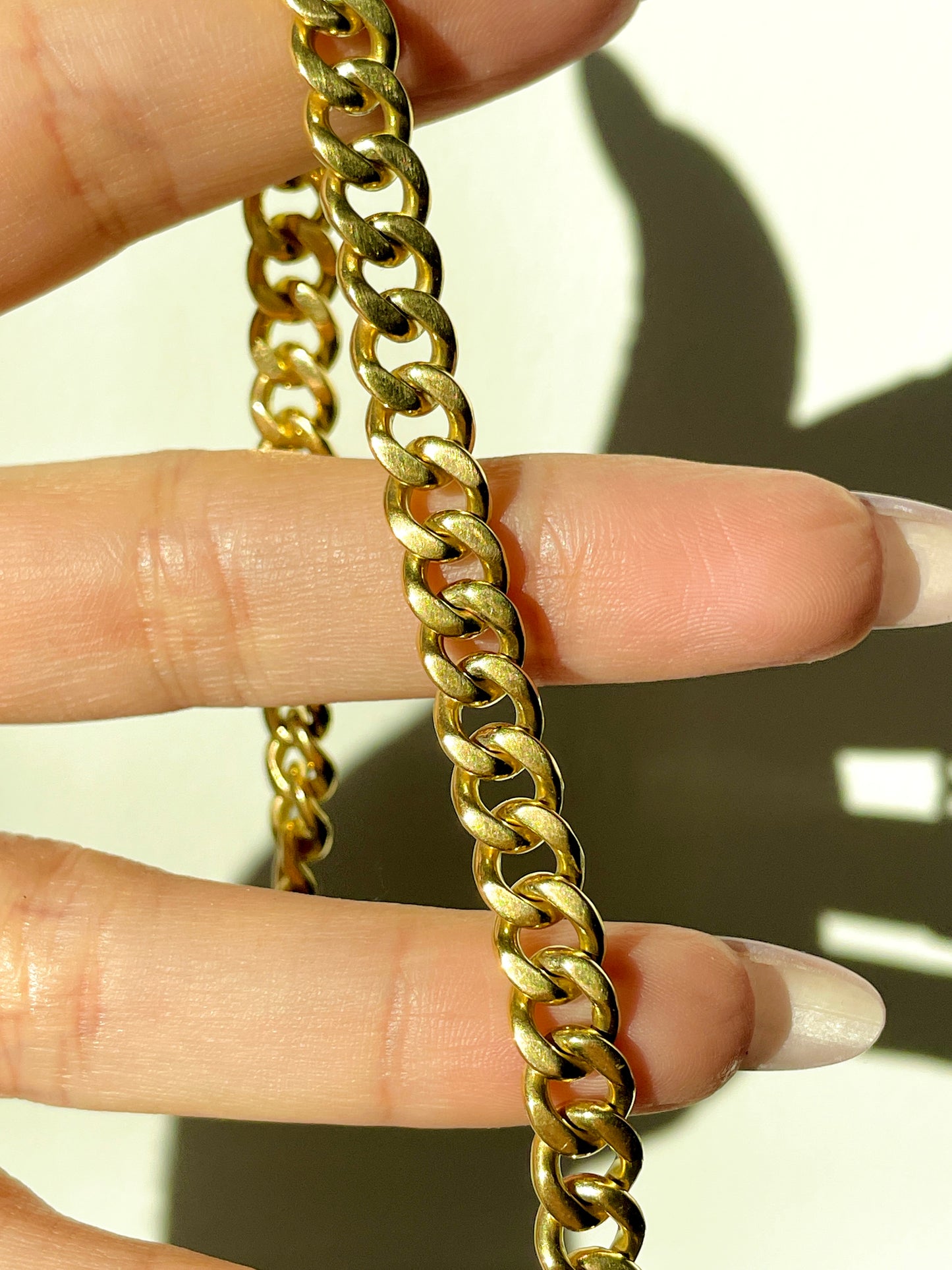 Vintage yellow solid 18K gold curb bracelet with safety chain, 7.75 inch