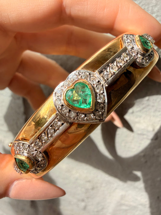 Vintage yellow 18K triple 1.73 ctw emerald and 1.14 ctw diamond heart bangle