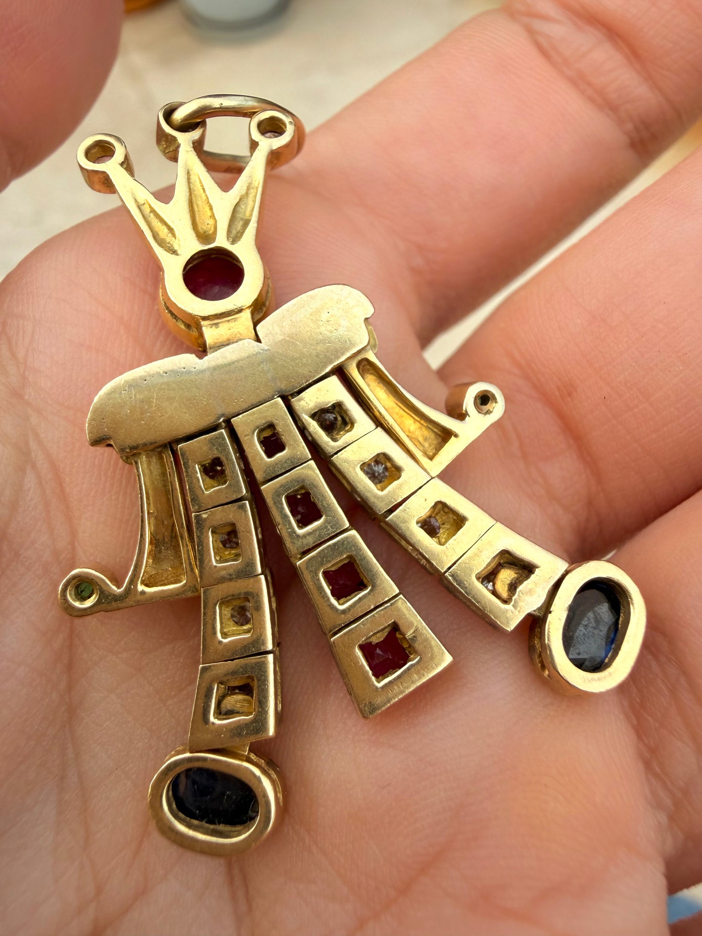 Vintage yellow 18K articulated jester pendant with over 3.1 ctw natural gemstones