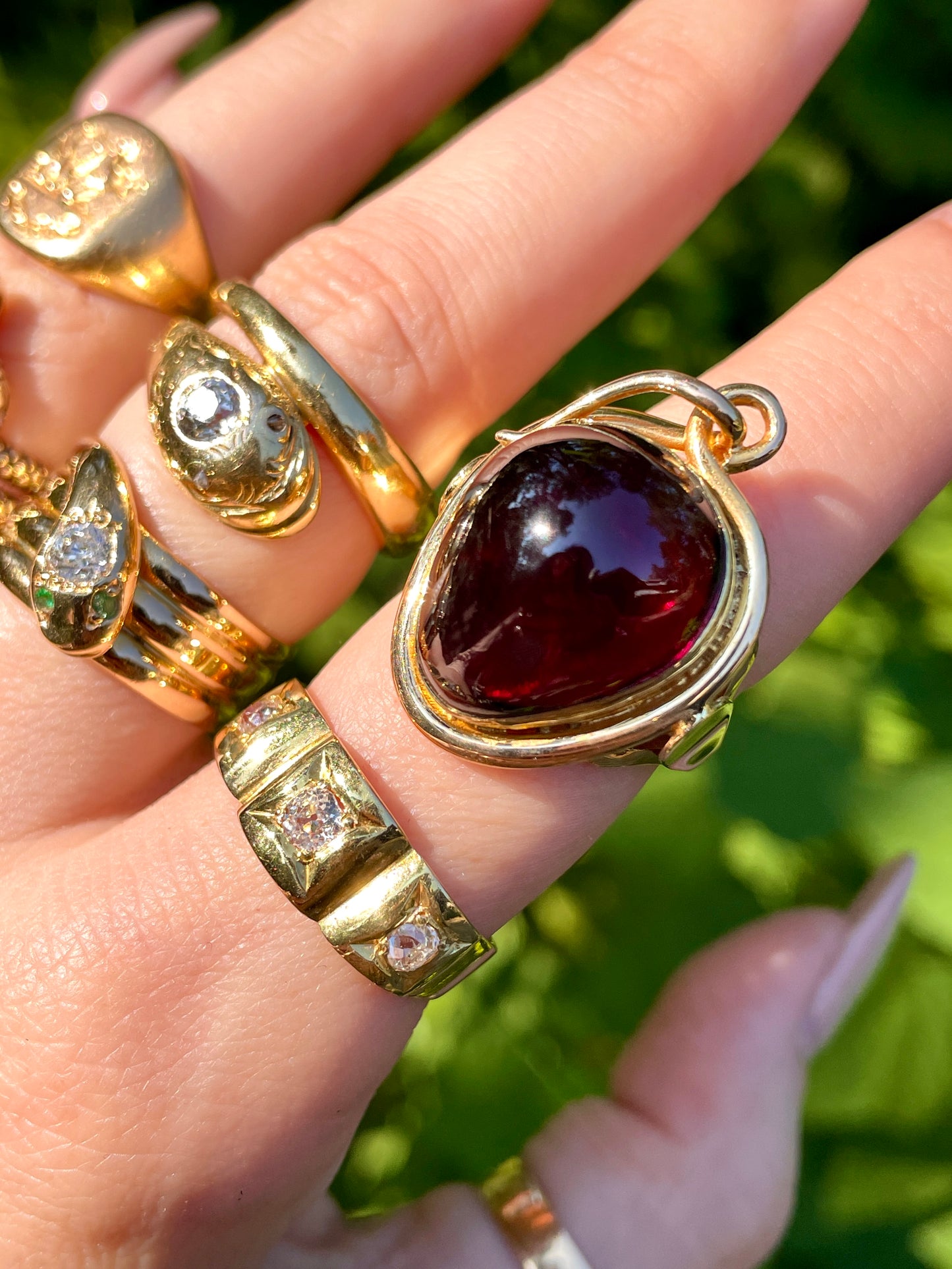 Antique yellow 14K garnet glass back locket ring, size 6.75