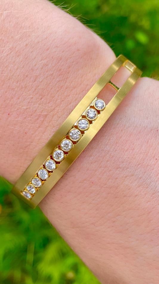 Vintage yellow 18K hinge bangle with 1.5 ctw kinetic sliding diamond bezels