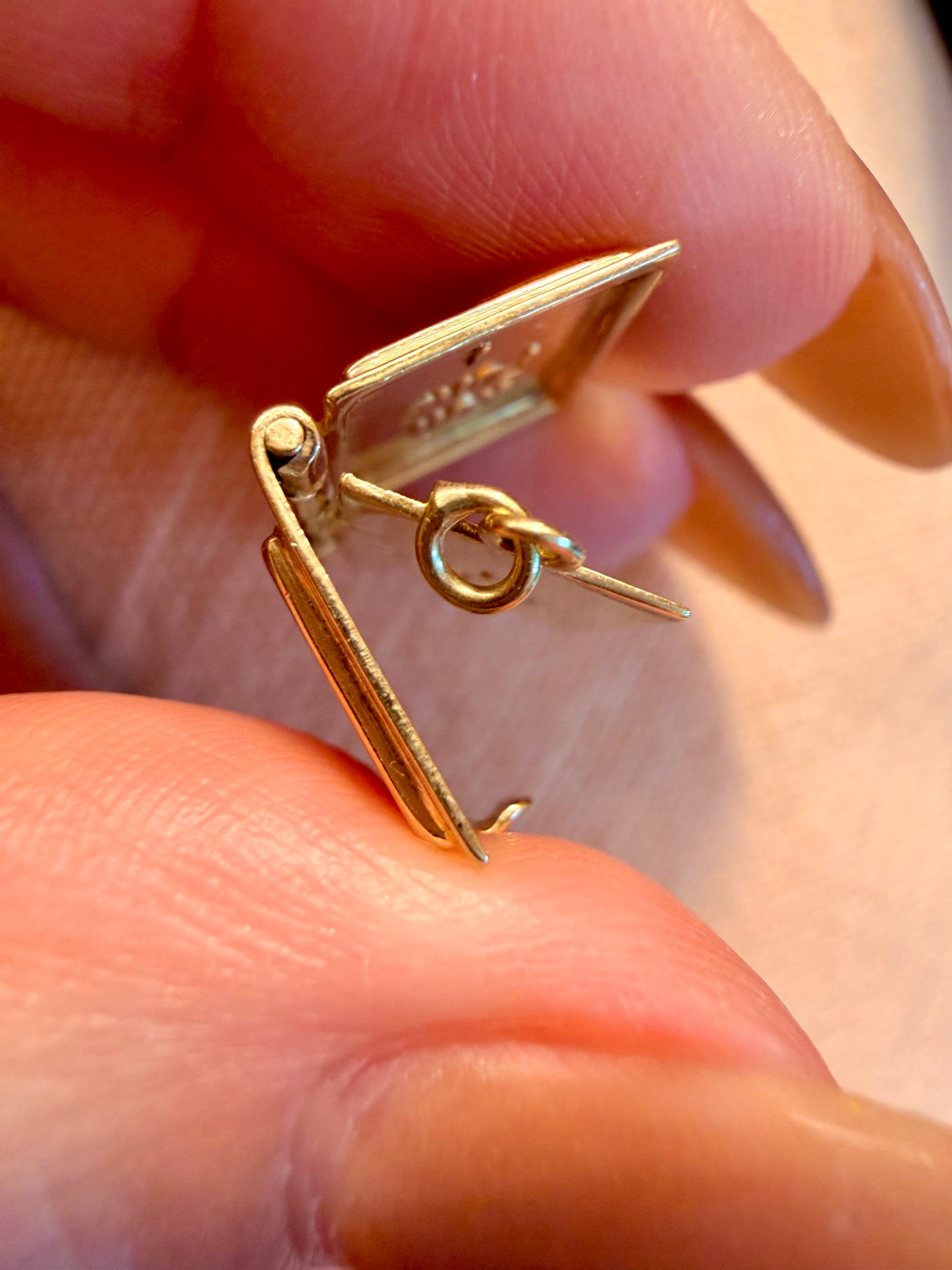 Vintage yellow 14K gold articulated marriage license book charm