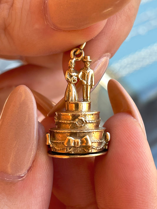 Vintage 9K gold articulated Wedding cake pendant with horseshoe surprise