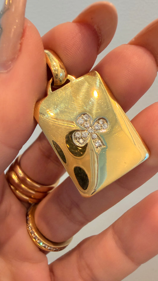 Vintage yellow 18K approx .12ctw diamond Bvlgari trefoil tag pendant