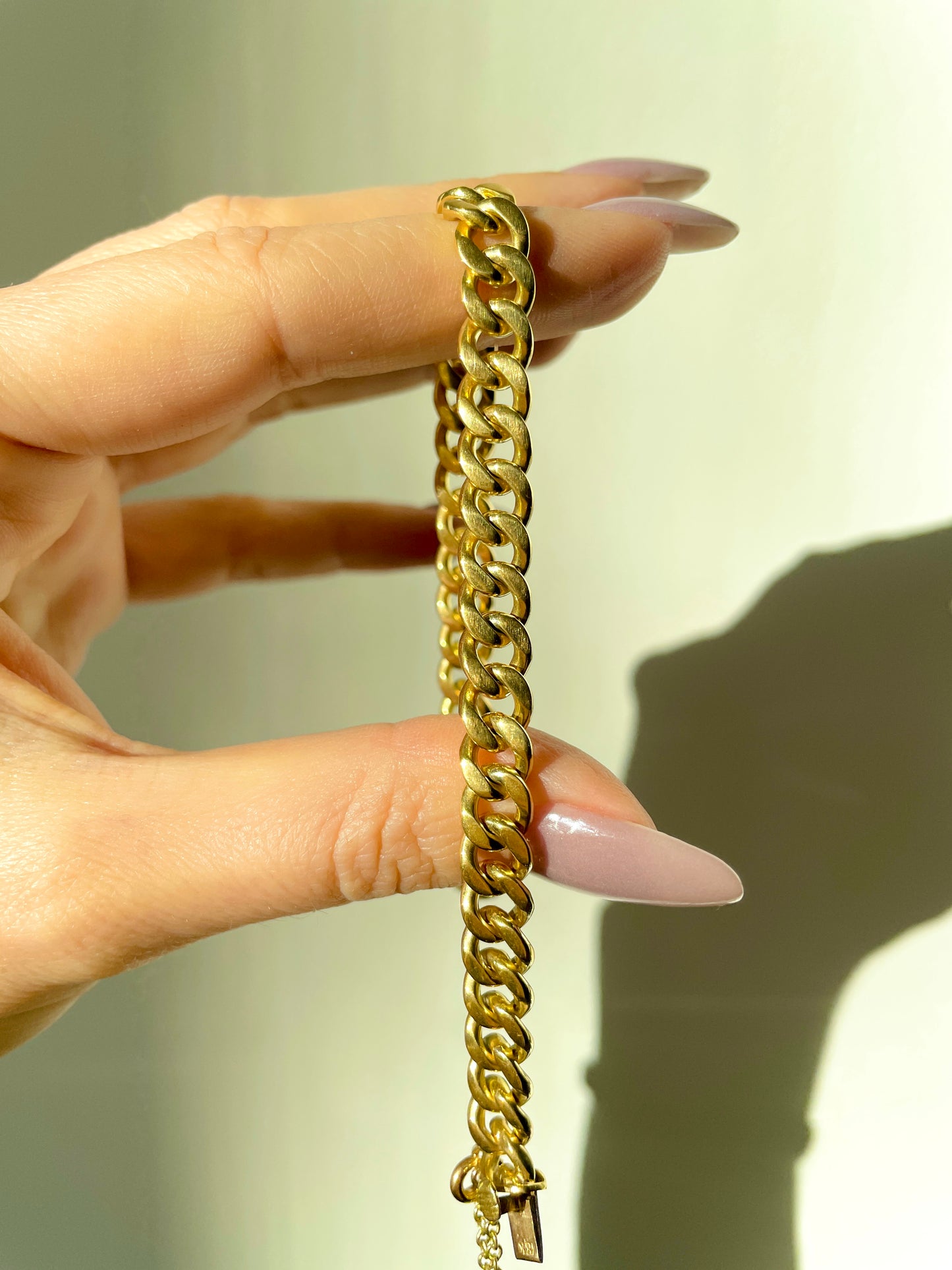 Vintage yellow solid 18K gold curb bracelet with safety chain, 7.75 inch