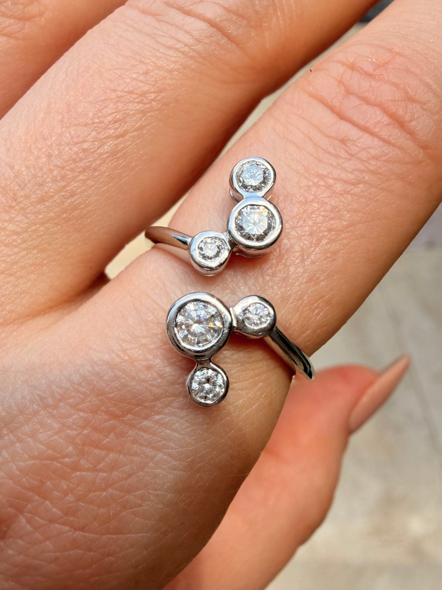 White 14K bezel set approx .55ctw diamond bubble ring, size 7.5