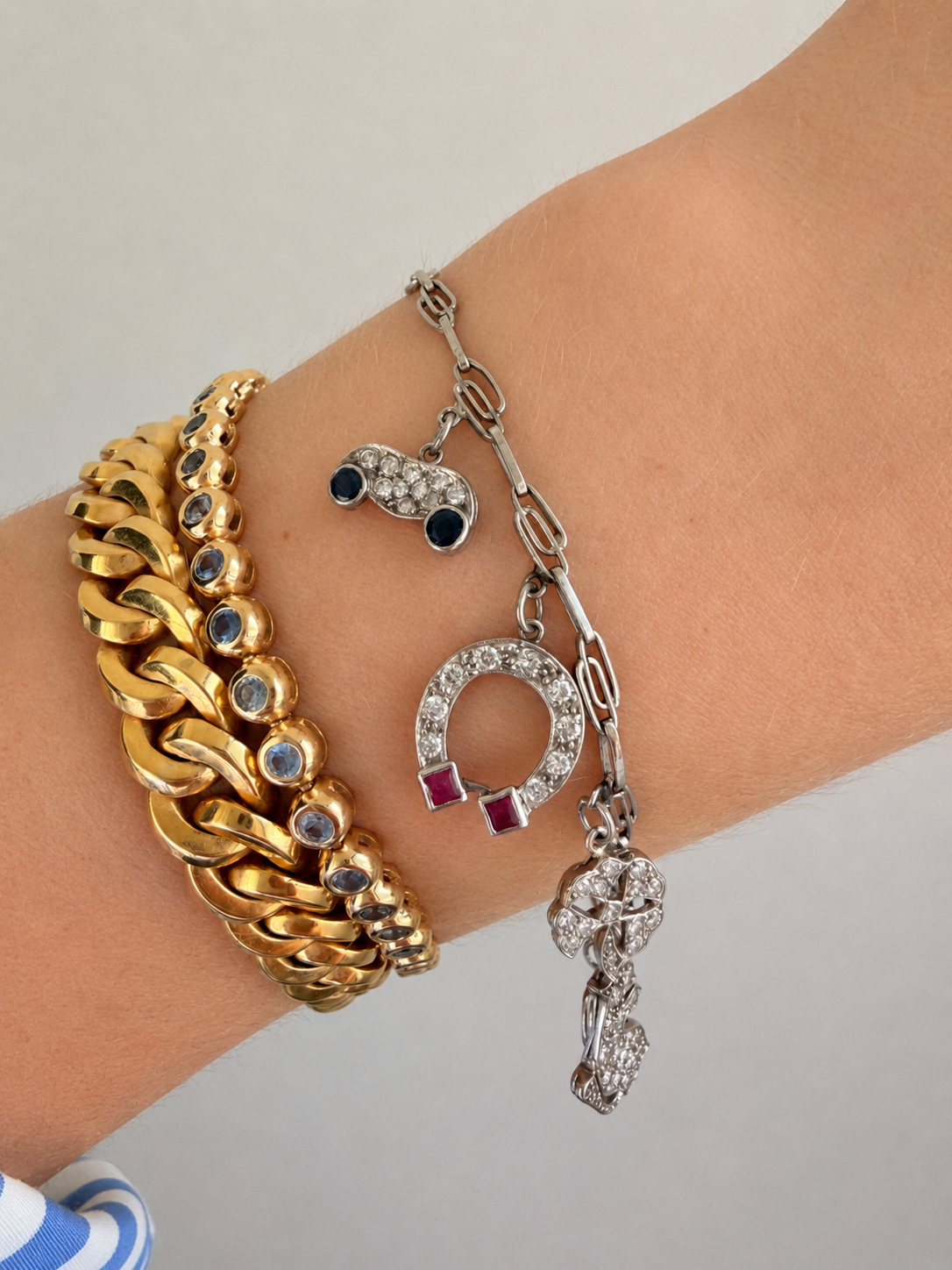 Antique platinum Art Deco charm bracelet with 1 ctw diamonds, sapphires and rubies, 7 inch