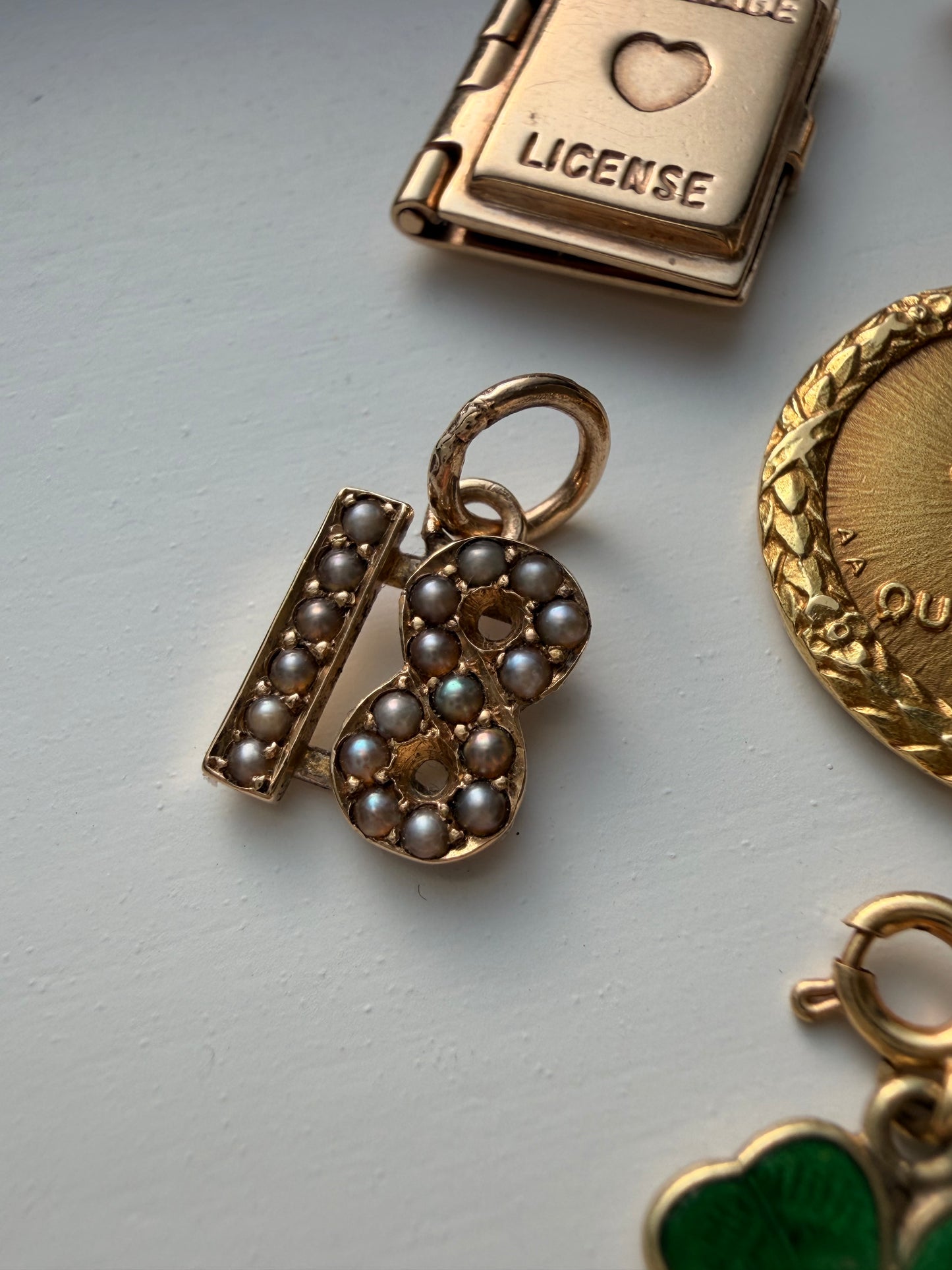 Antique yellow 10K gold and pearl number 18 charm