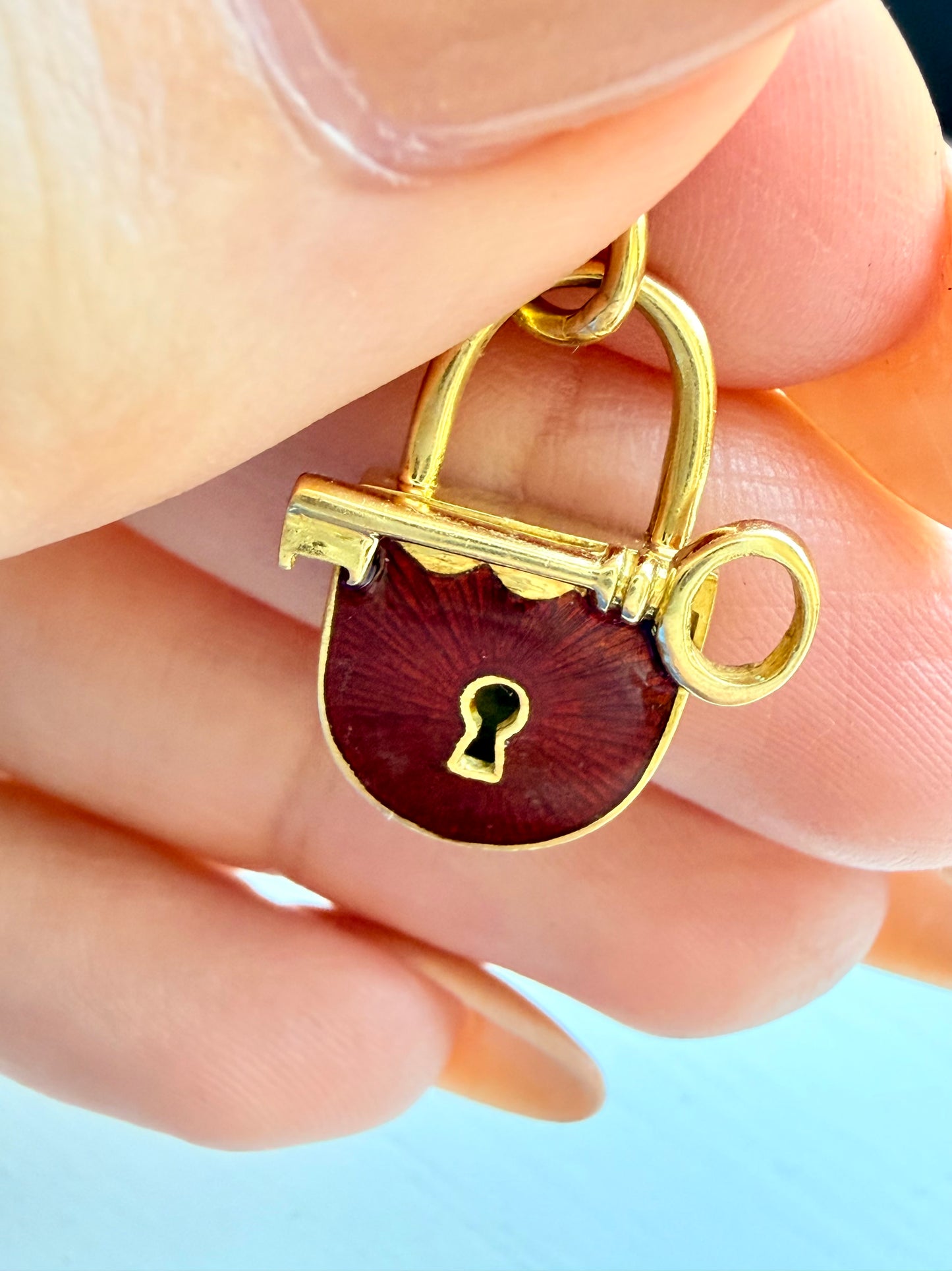 Vintage yellow 18K gold and red enamel lock and key pendant