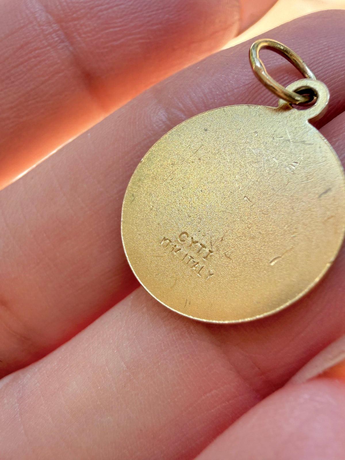 Vintage yellow 14K cherub medal charm