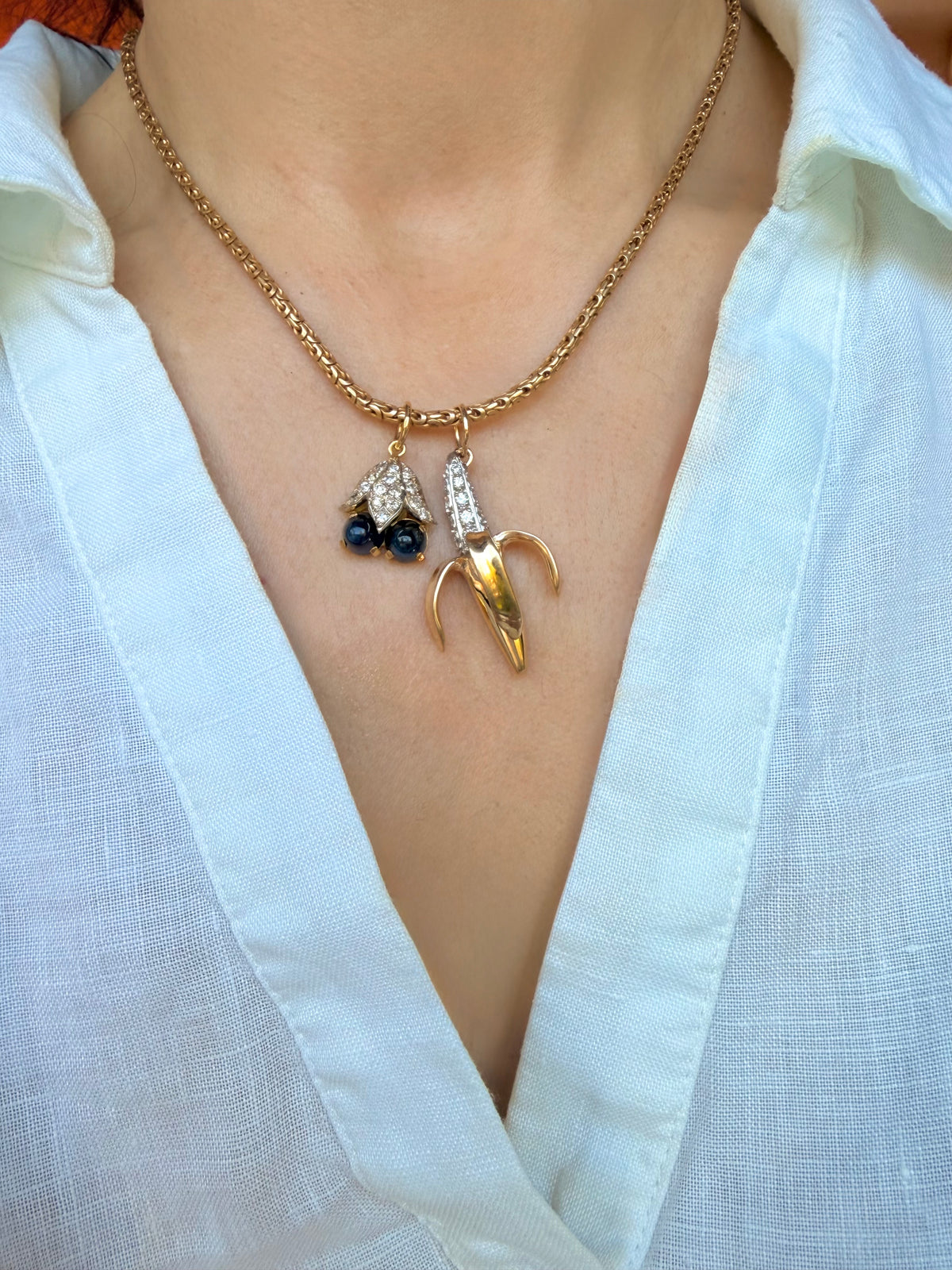 Vintage 18K approx .52 ctw old mine and old cut diamond and sapphire cabochon blueberries pendant
