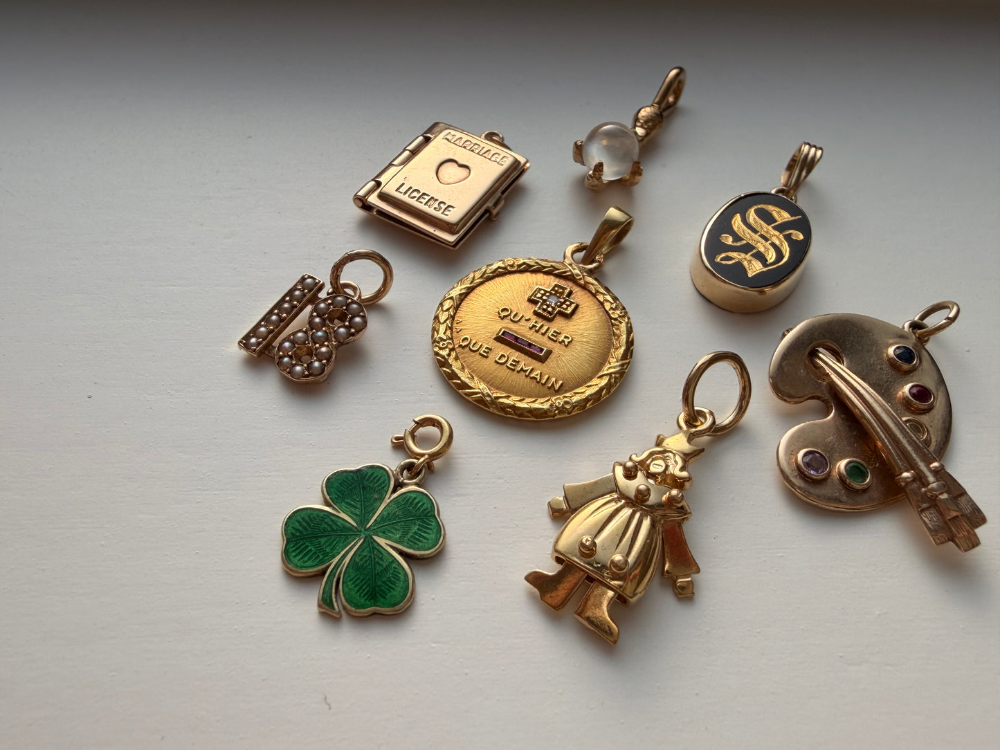 Antique yellow 10K gold and pearl number 18 charm