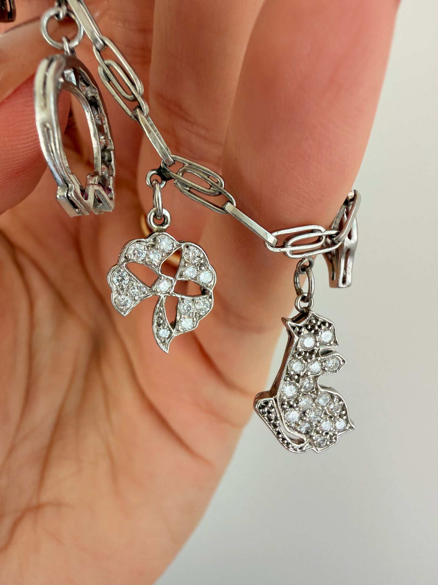 Antique platinum Art Deco charm bracelet with 1 ctw diamonds, sapphires and rubies, 7 inch