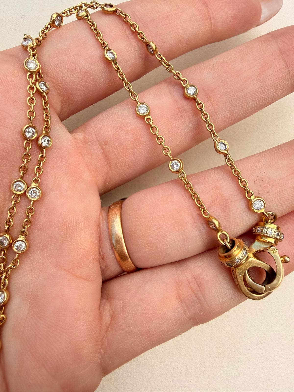 Vintage yellow 14K approx 1.4 ctw diamond bezel station chain with cuff clasp, 17.5 inch