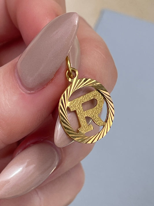 Vintage yellow 22K letter R engine turned charm