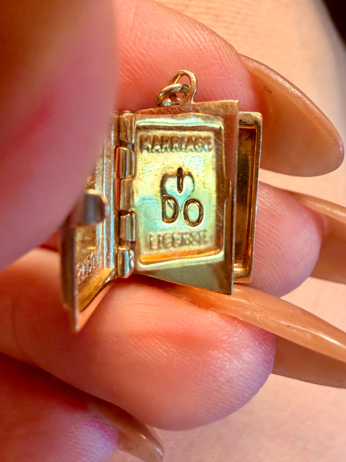 Vintage yellow 14K gold articulated marriage license book charm