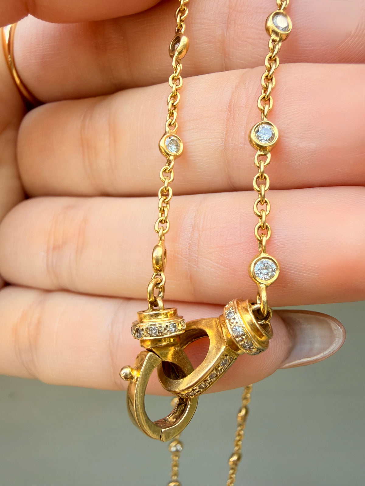 Vintage yellow 14K approx 1.4 ctw diamond bezel station chain with cuff clasp, 17.5 inch