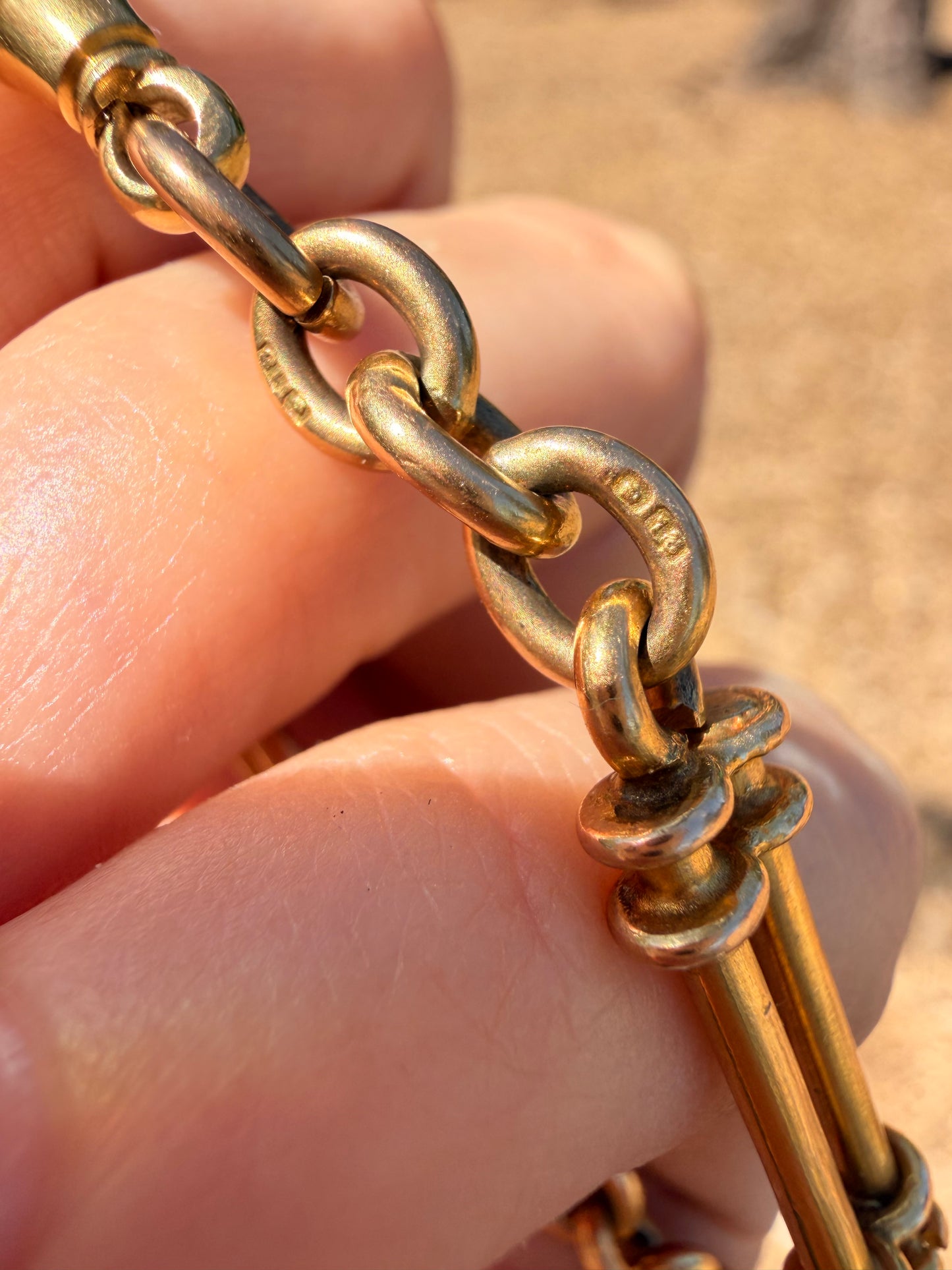 Antique yellow 18K fancy trombone watch chain with double dog clips, 19 and 1/8 inch long with extra link for extension