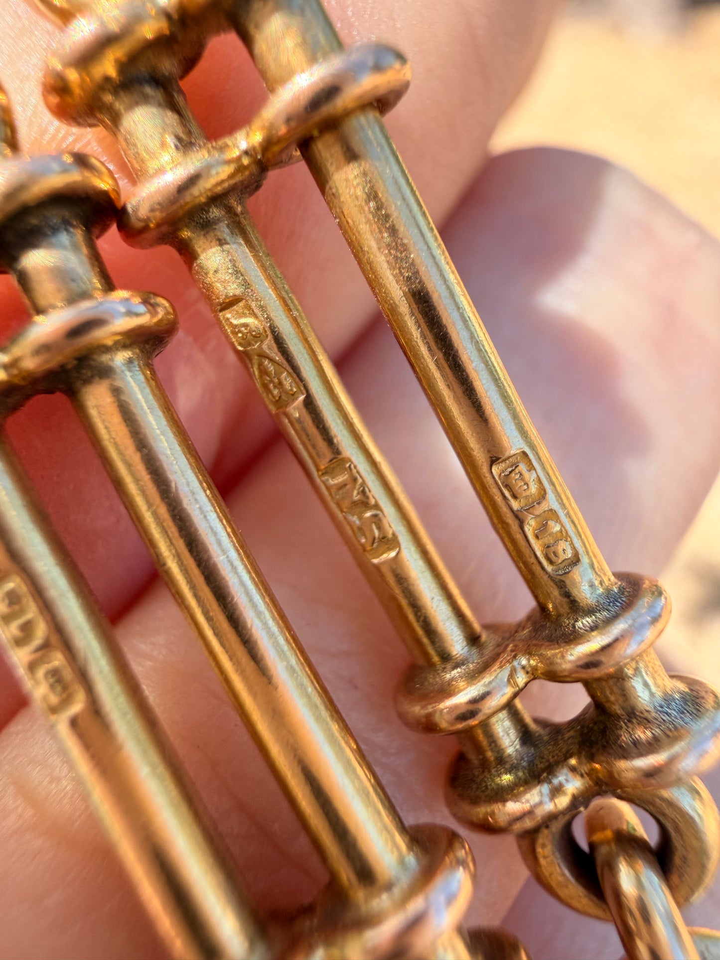 Antique yellow 18K fancy trombone watch chain with double dog clips, 19 and 1/8 inch long with extra link for extension