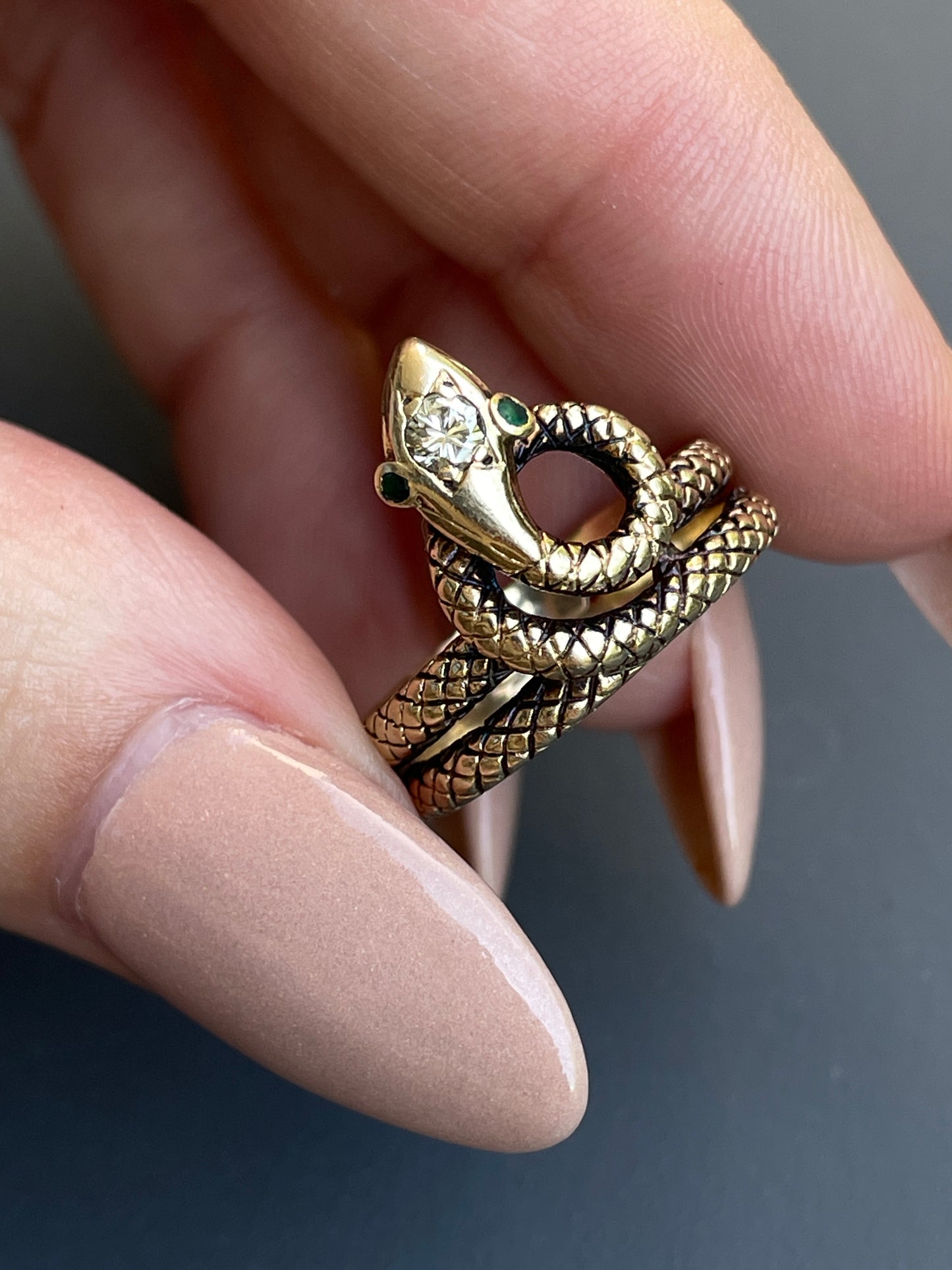 Vintage yellow 14K textured snake ring with .1 ctw diamond and emerald eyes, size 6