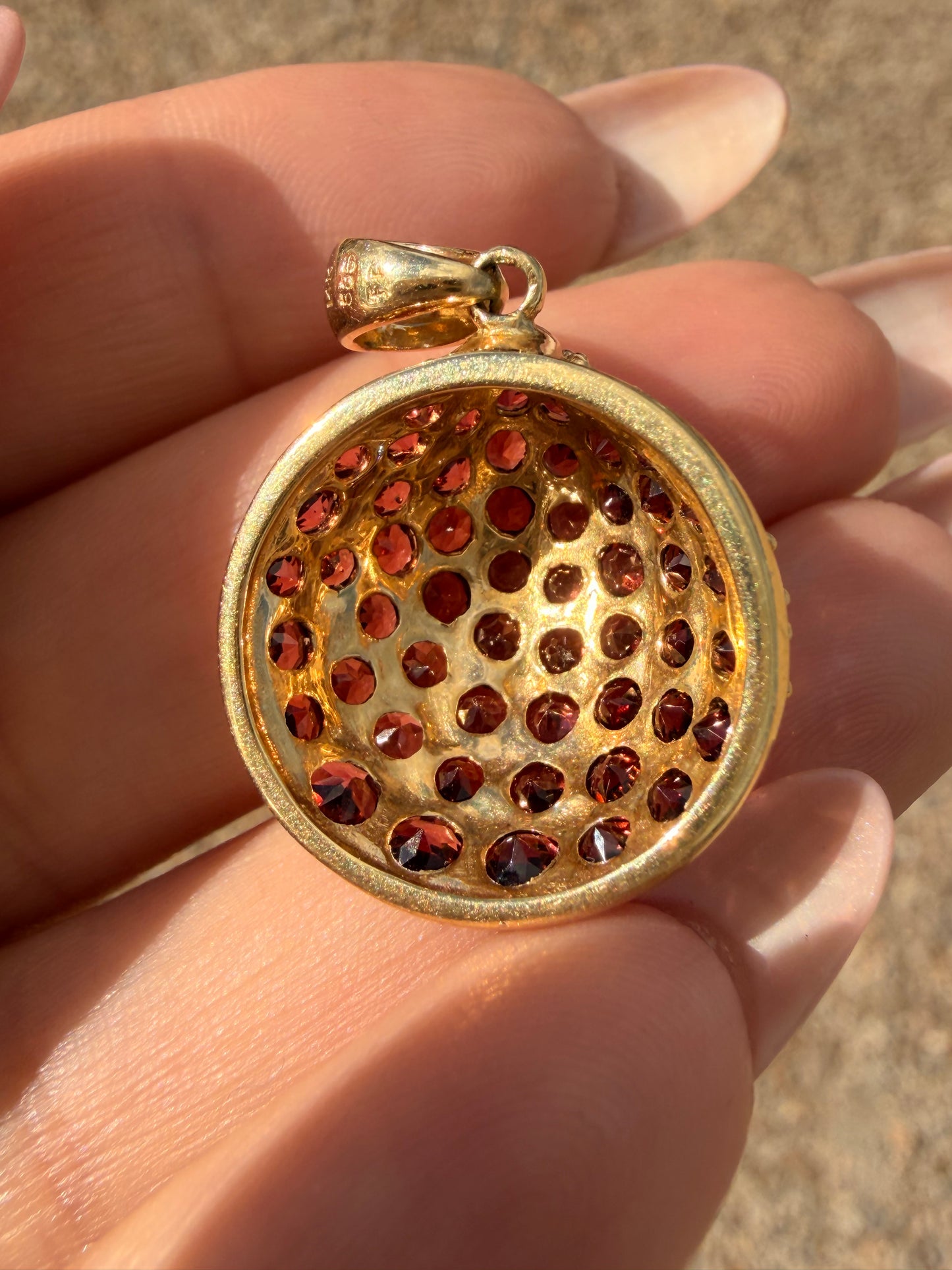 Vintage yellow 14K gold and garnet shell charm