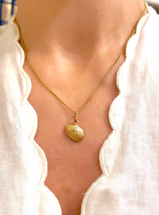 Vintage yellow 14K clamshell charm