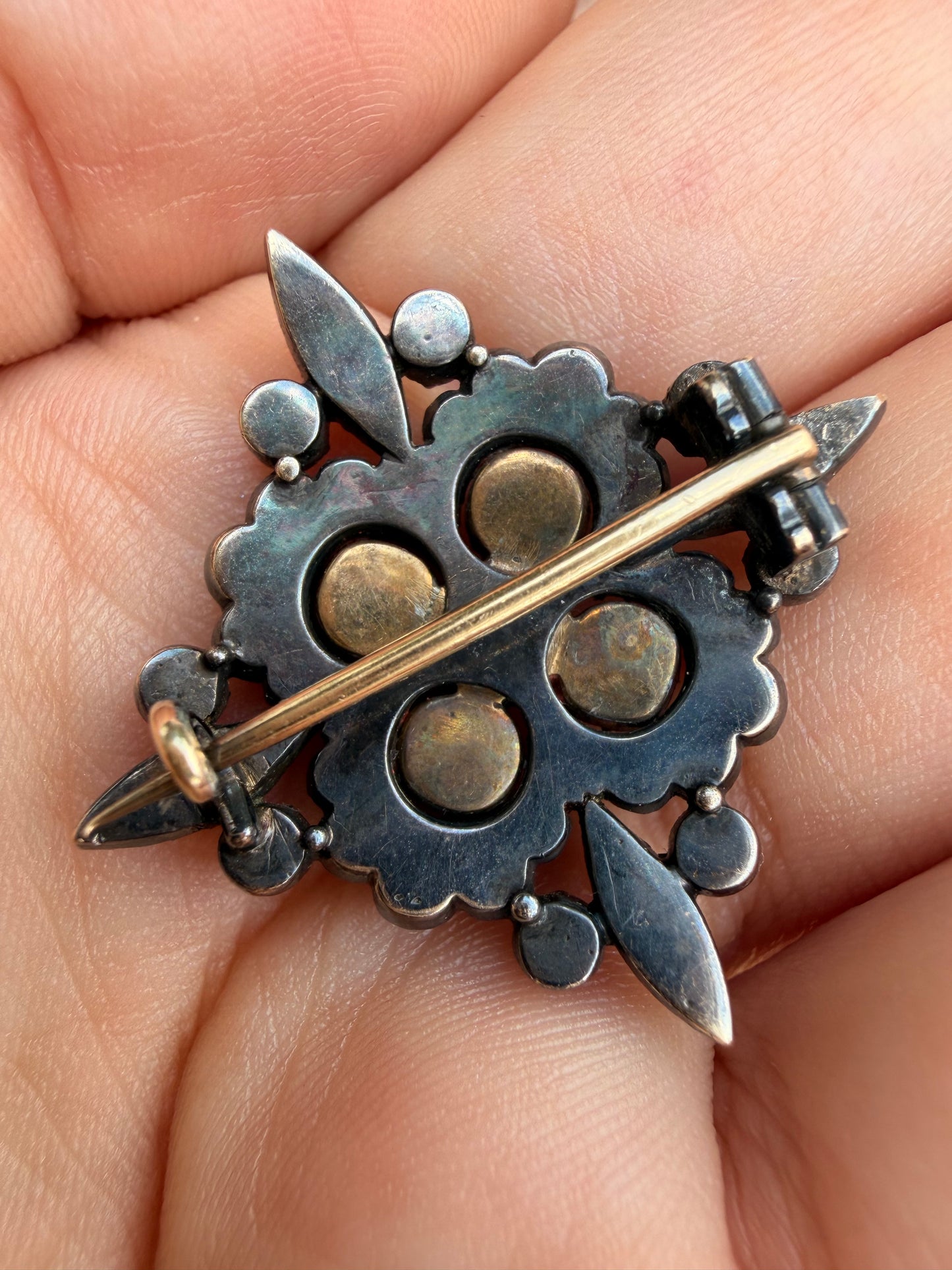 Antique 18K and silver approx 1.6 ctw old mine, peruzzi and old cut diamond, .75 ctw Burma ruby, and .38 ctw emerald brooch