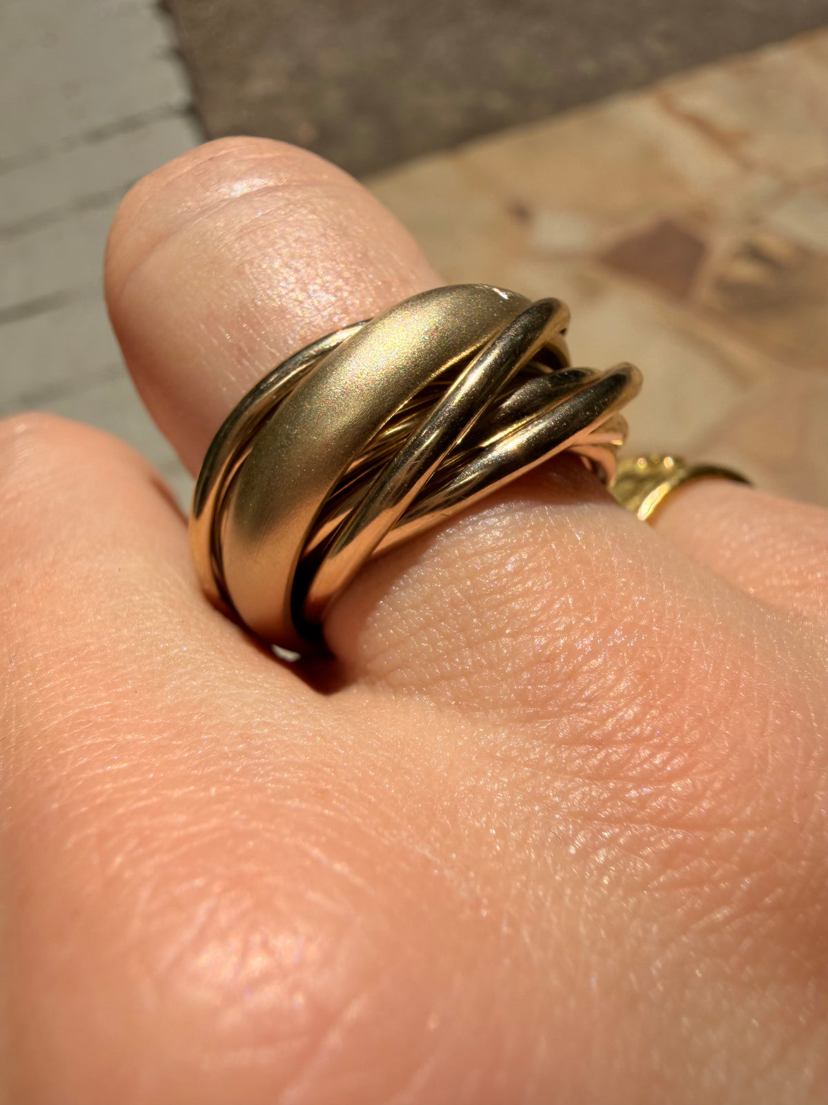 Vintage yellow 18K Pomellato designer eleven band rolling ring, size 6.25-6.5