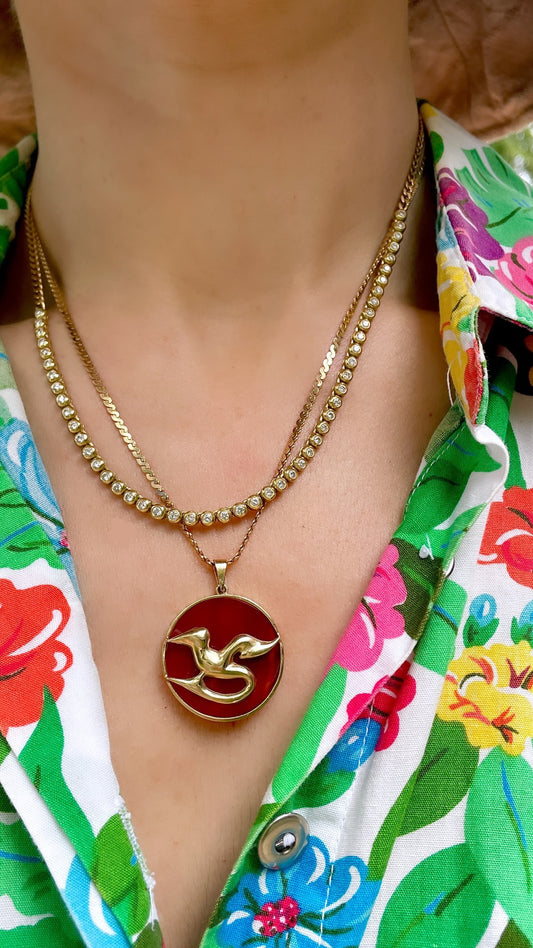 Vintage yellow 14K carnelian disc pendant with bird motif