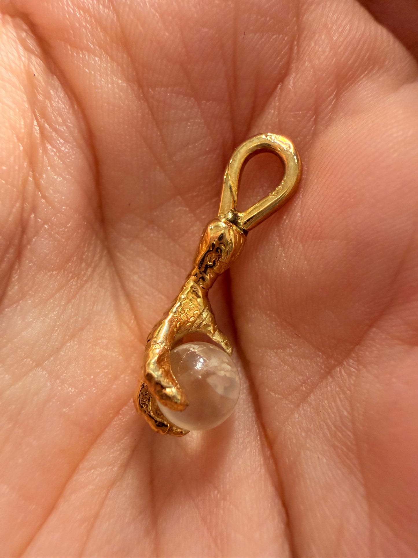 Antique yellow 14K gold and moonstone orb talon charm