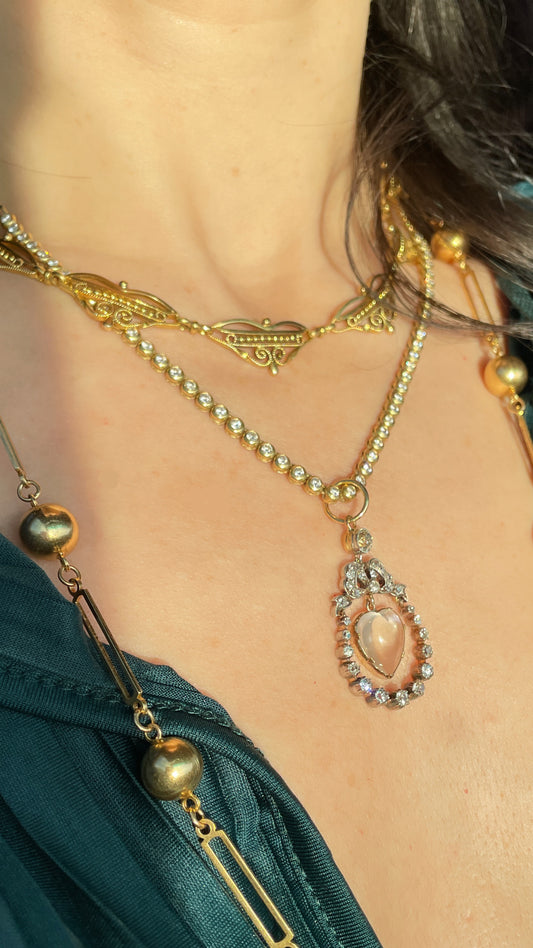 Incredible Antique 18K and 14K approx 1.22 ctw diamond and heart shaped moonstone bow pendant