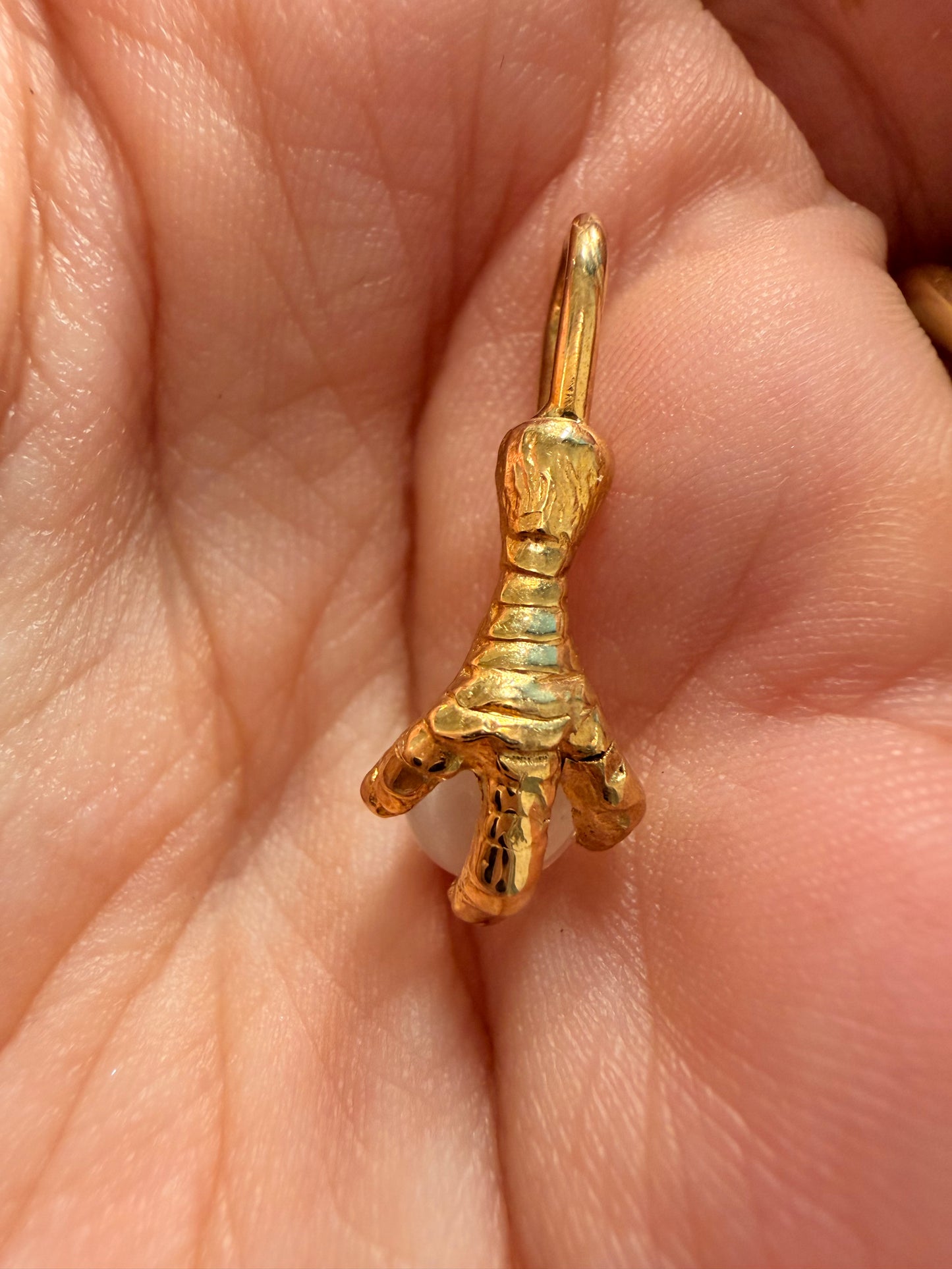 Antique yellow 14K gold and moonstone orb talon charm